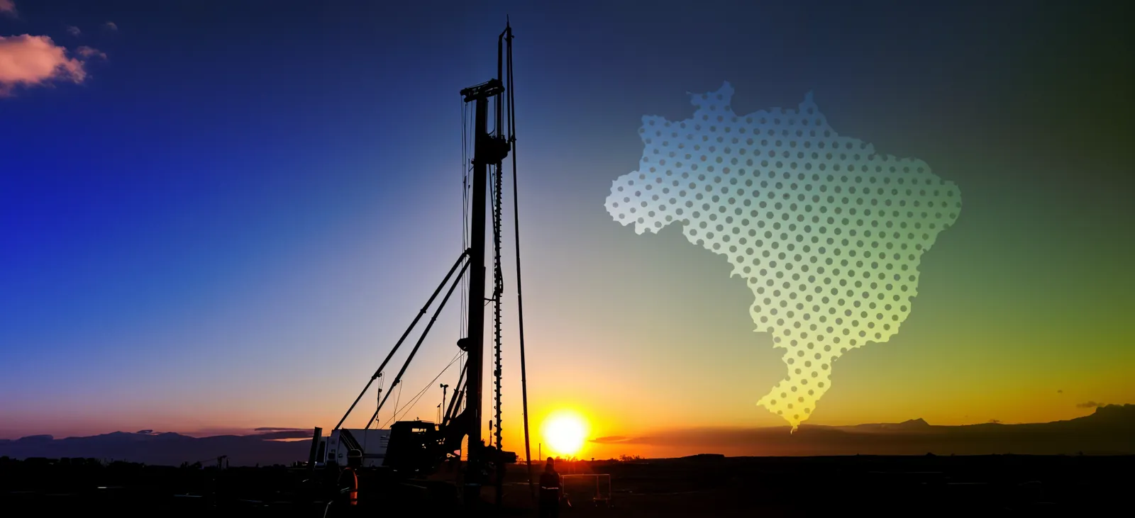 Máquina de fundações ao pôr do sol com mapa do Brasil